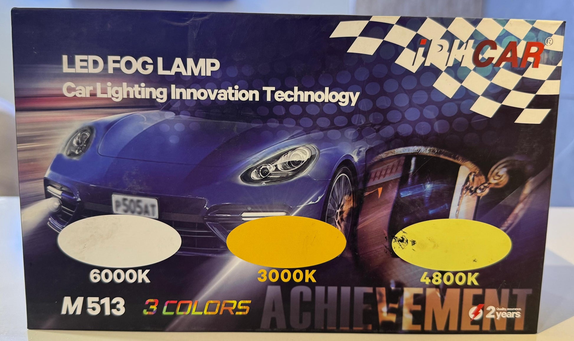 Product packaging for LED fog lamps with a car image on a table.
