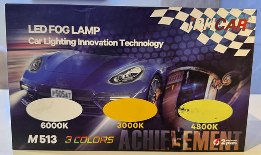 Product packaging for LED fog lamps with a car image on a table.