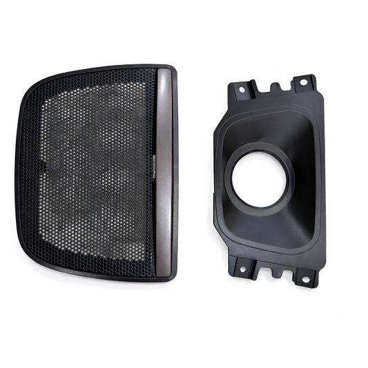 Black mesh grille and speaker component on a white background