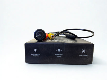 Black electronic device with cables on a white background