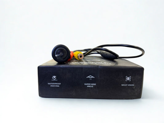 Black electronic device with cables on a white background