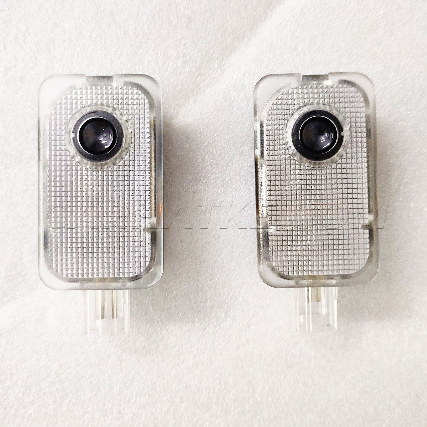 Two electronic devices with camera lenses on a white background