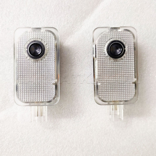 Two electronic devices with camera lenses on a white background