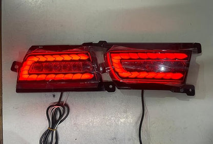 Pair of red tail lights on a white background