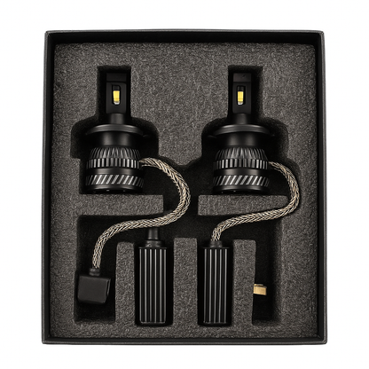 Two car light bulbs in a black box with gray interior