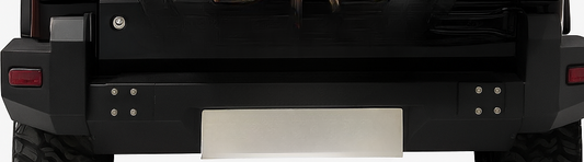 Black vehicle bumper with a metallic plate on a white background
