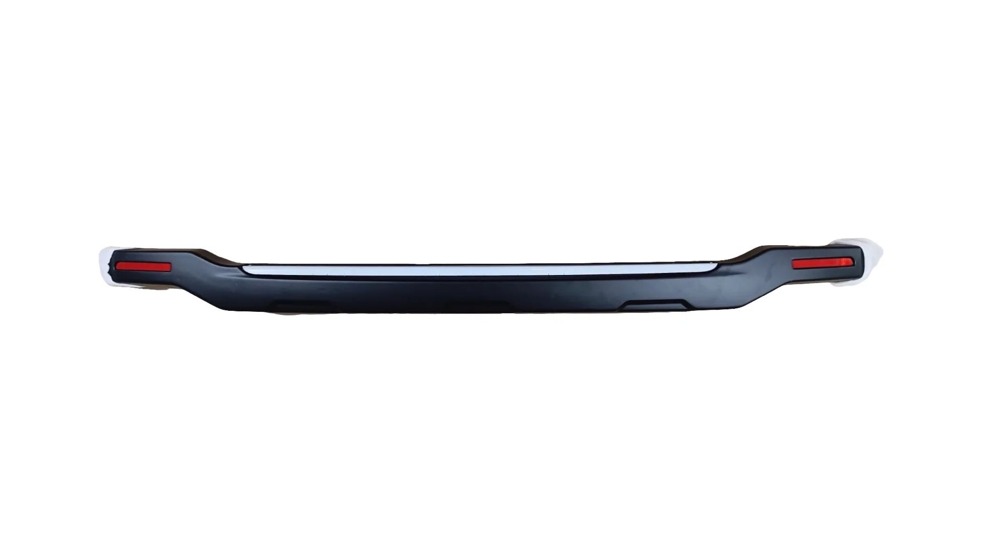 Black vehicle bumper with red reflectors on a white background