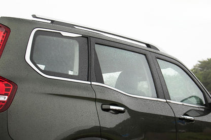 Car window with a sunshade on a gray vehicle