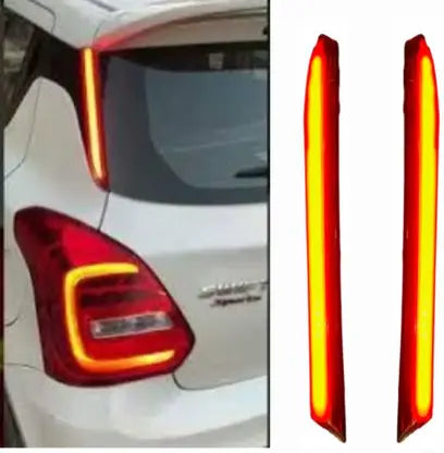 Car tail light assembly with red and yellow colors on a white car.