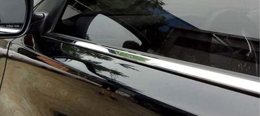 Close-up of a car's chrome side mirror and trim
