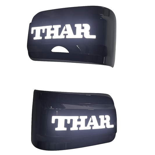 Two black car fenders with 'THAR' branding on a white background