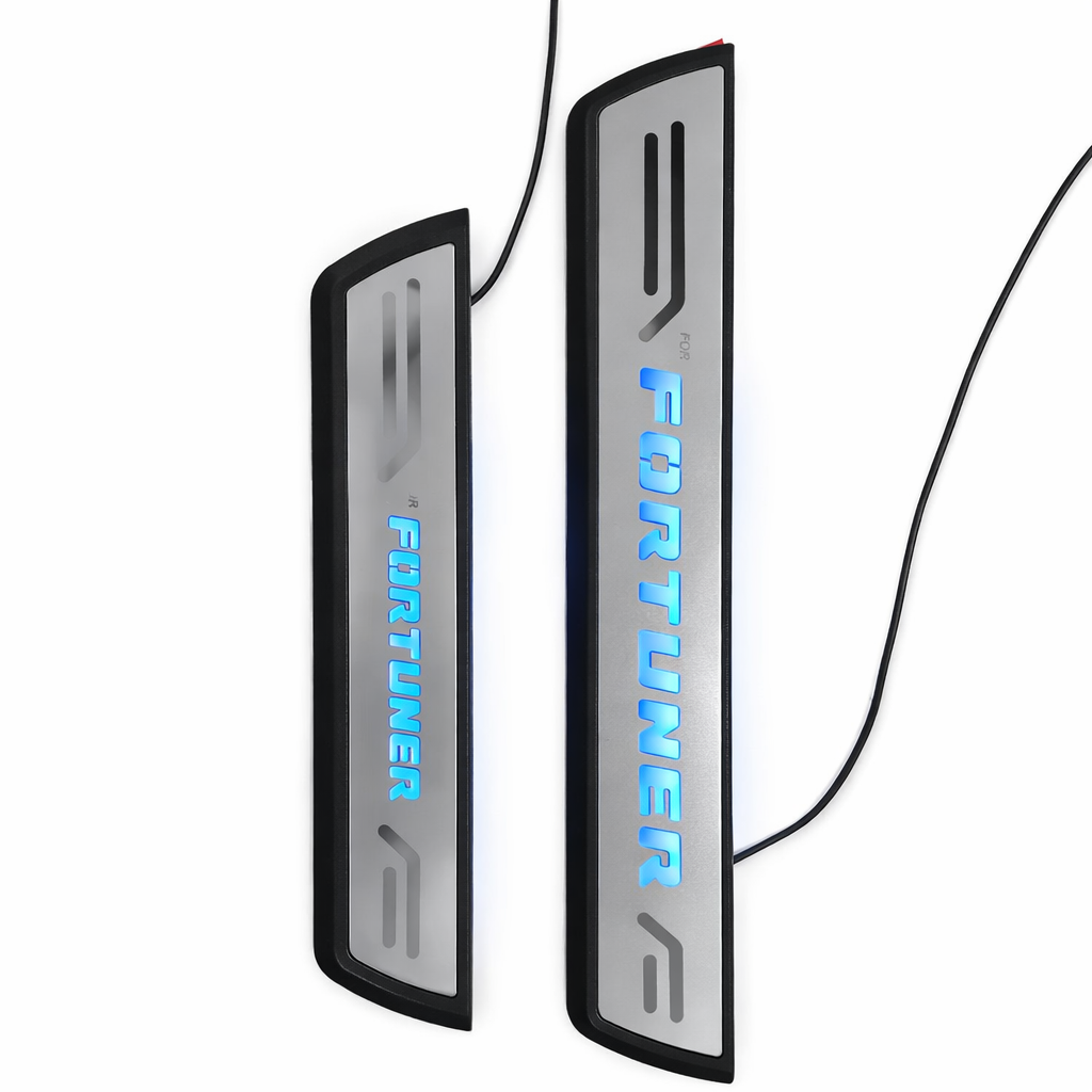 Two illuminated door sill protectors with 'Fortuner' branding on a white background