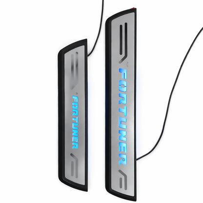 Two illuminated door sill protectors with 'Fortuner' branding on a white background