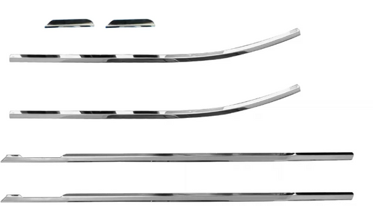 Set of chrome car trim pieces on a white background